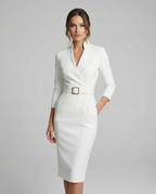 White midi dress with V-neck, long sleeves, and belted waist.
