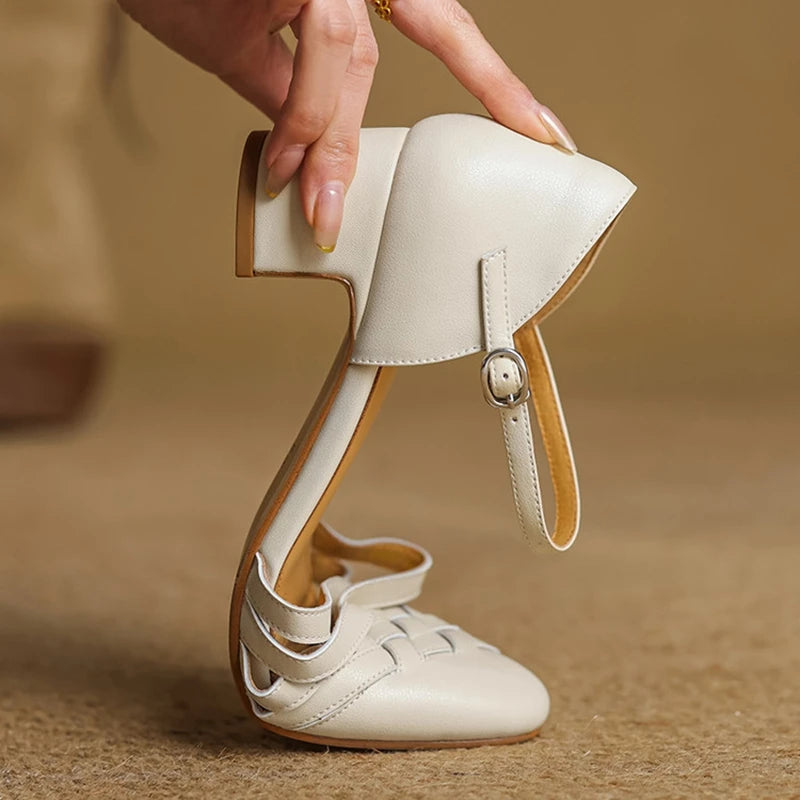 Beige leather heels with ankle strap buckle and stacked block heel