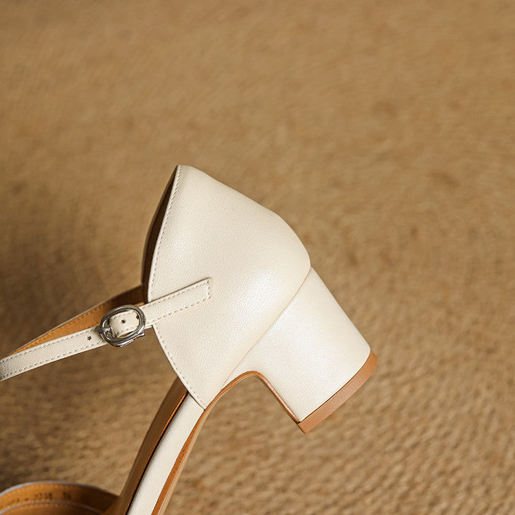 Beige leather ankle-strap heel with curved strap and buckle hardware