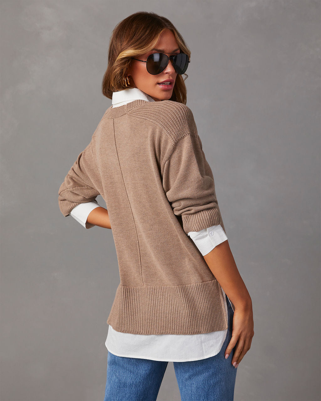Camel V-neck pullover sweater with white contrast shirt hem; long sleeves