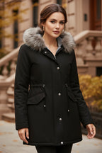 Women’s parka coat in black with faux fur trimmed hood and front snap closure