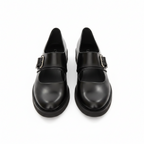 Women's black leather loafers with buckle strap, closed toe and low profile sole.