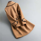 Champagne beige wool coat with black-trim lapels, belt tie, and double button