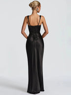 Black satin open-back maxi dress with thin halter straps and gathered back detail