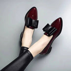 Wine red patent loafers with black bow strap detail and low block heel