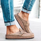 Taupe suede slip-on loafers with buckle strap and stitched moc toe