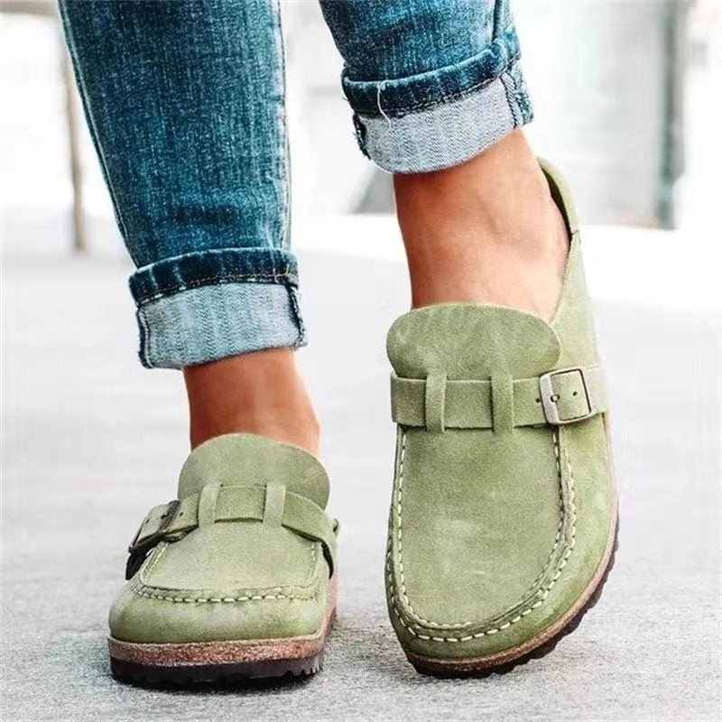 Green slip-on loafers with buckle strap and stitched moc toe