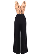 Black wide-leg jumpsuit with sleeveless polka-dot bodice and waist belt