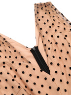 Beige polka-dot fabric patch with black zipper and stitched edge