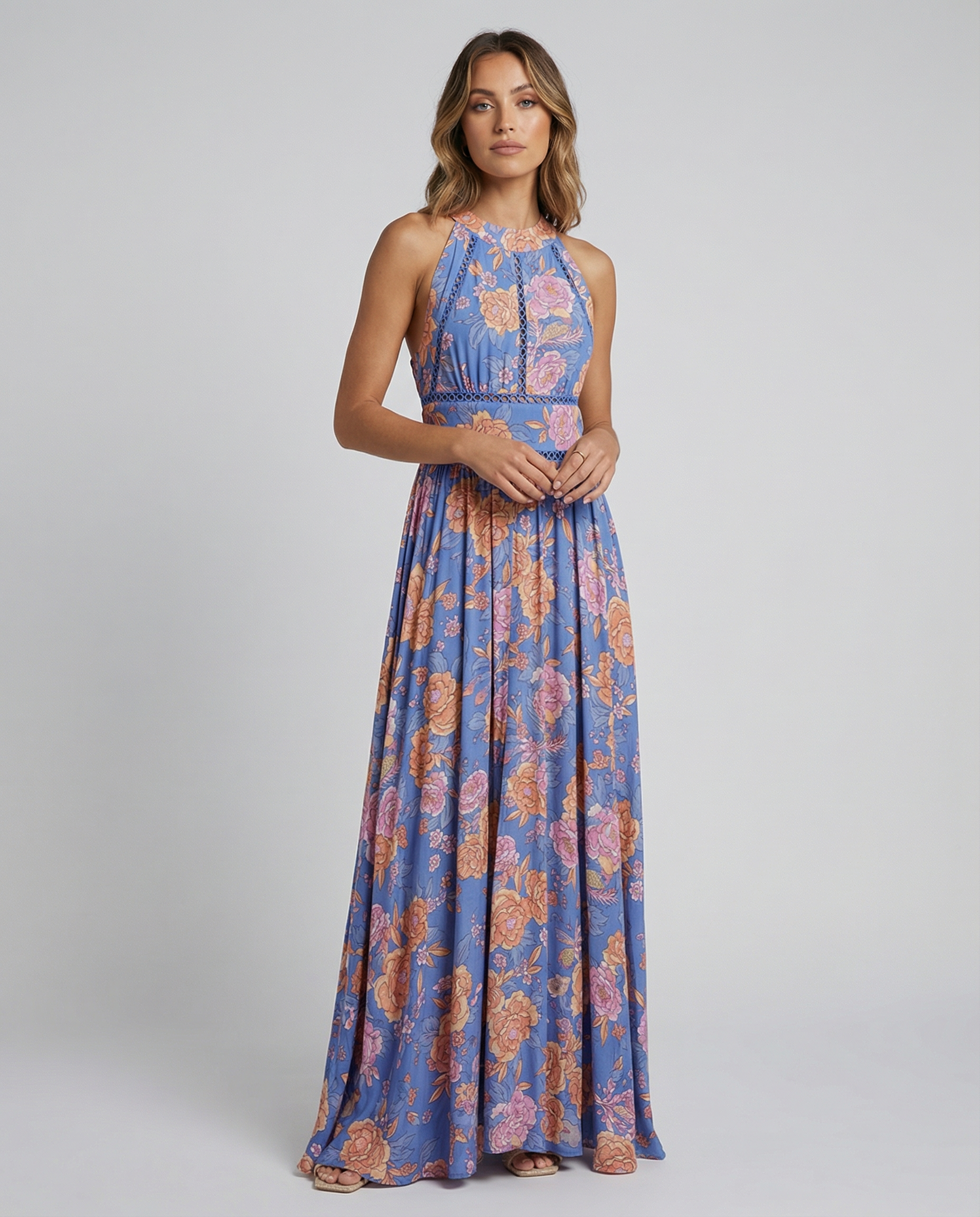 Blue sleeveless floral maxi dress with smocked waist and gathered skirt