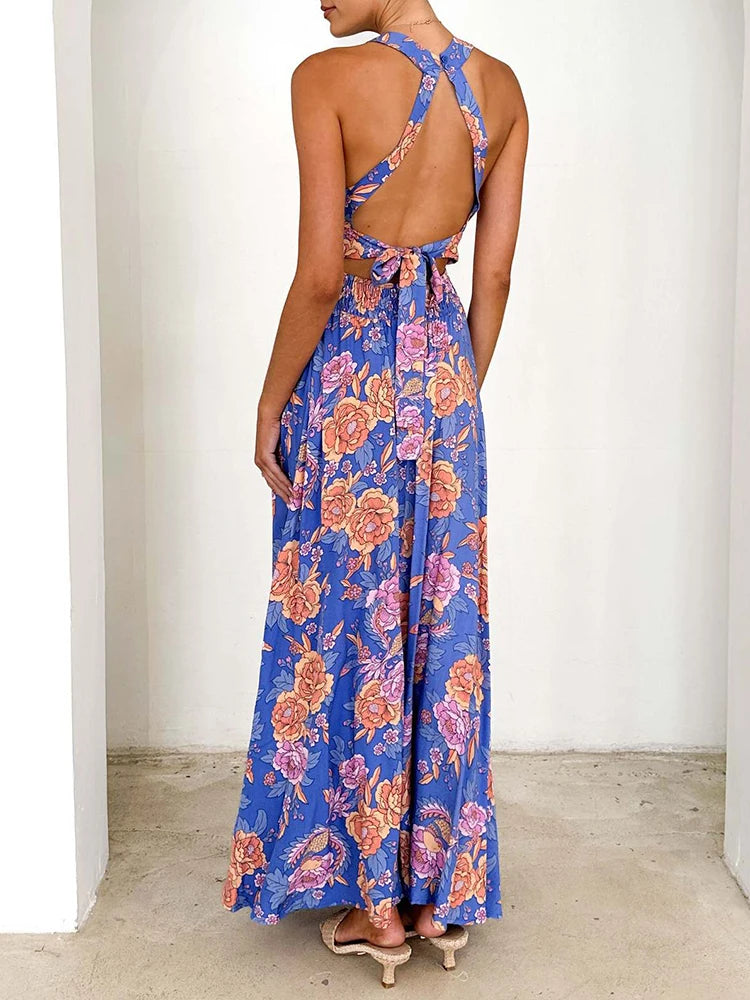 Blue sleeveless floral maxi dress with crisscross back straps and open back