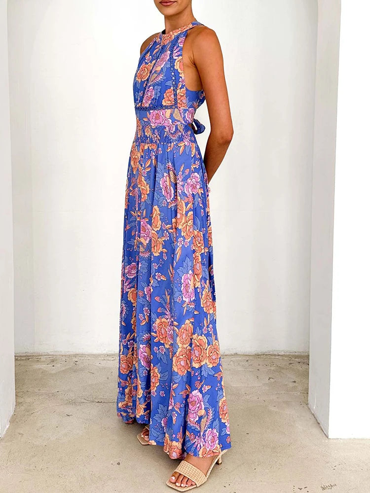 Blue sleeveless floral maxi dress with side view, high neck and front slit