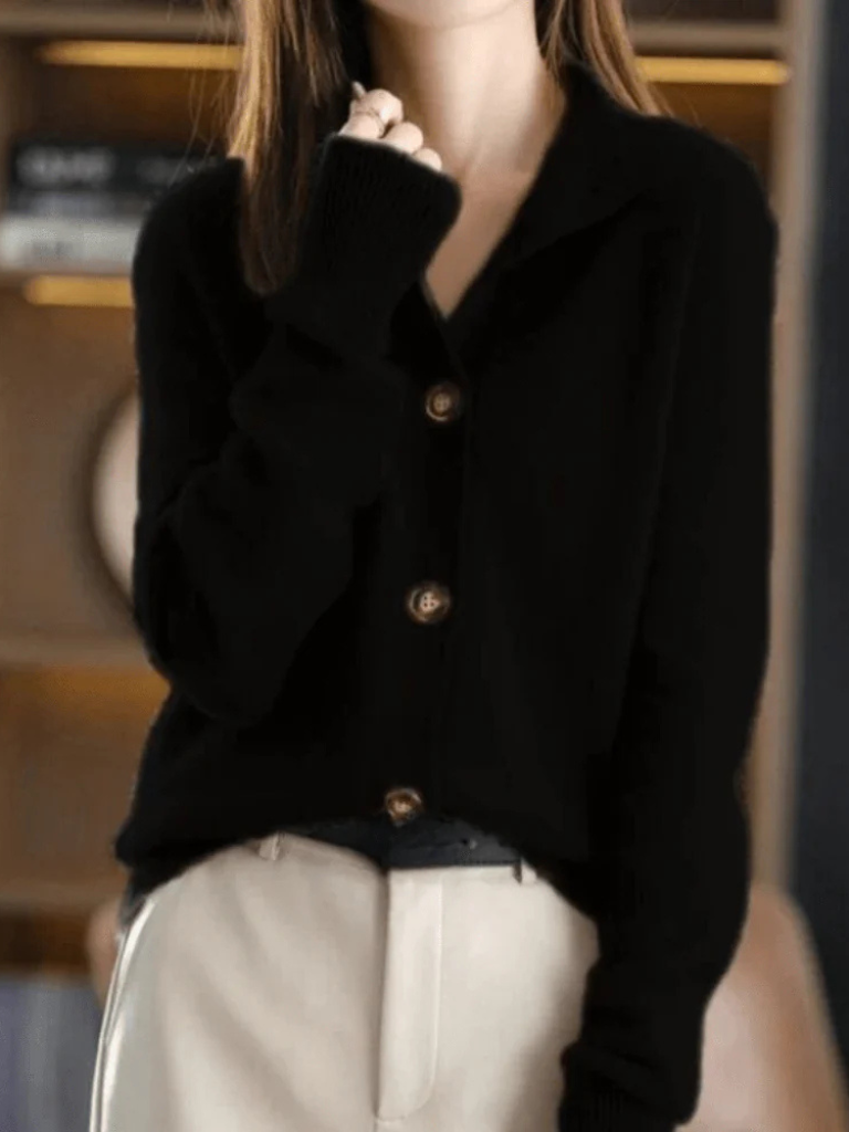 Black knit button-front cardigan with pointed collar and wood-tone buttons