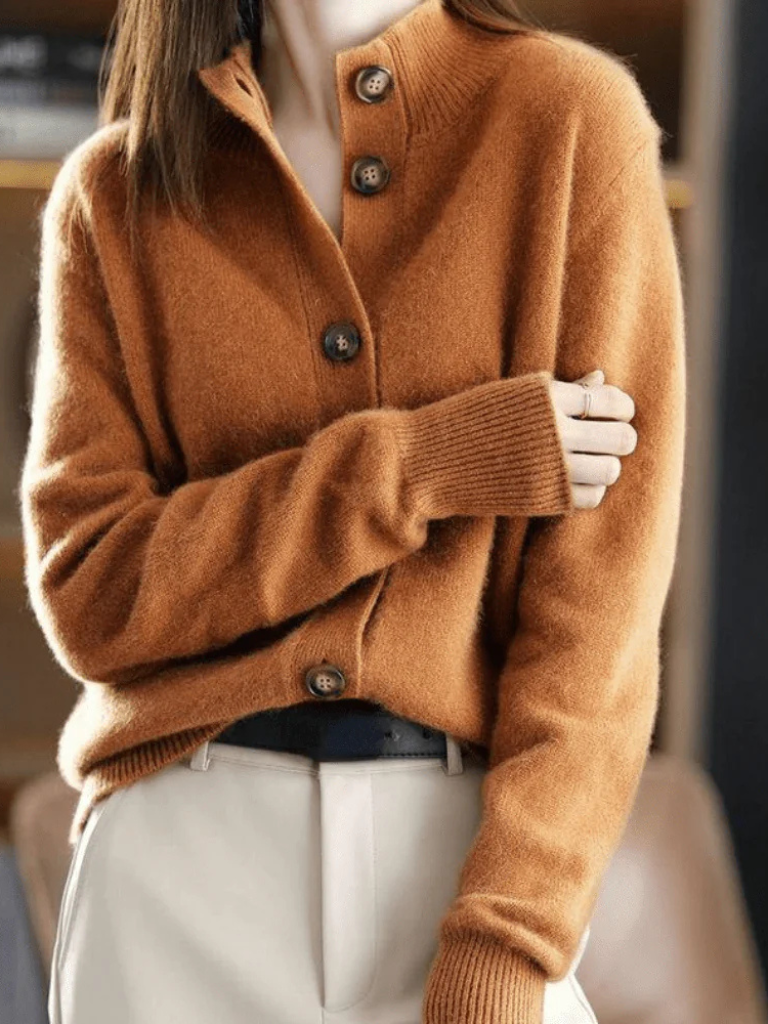 Caramel knit cardigan close-up: button placket, pointed collar, ribbed cuffs