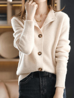 Cream knit button-front cardigan with pointed collar and wood-tone buttons