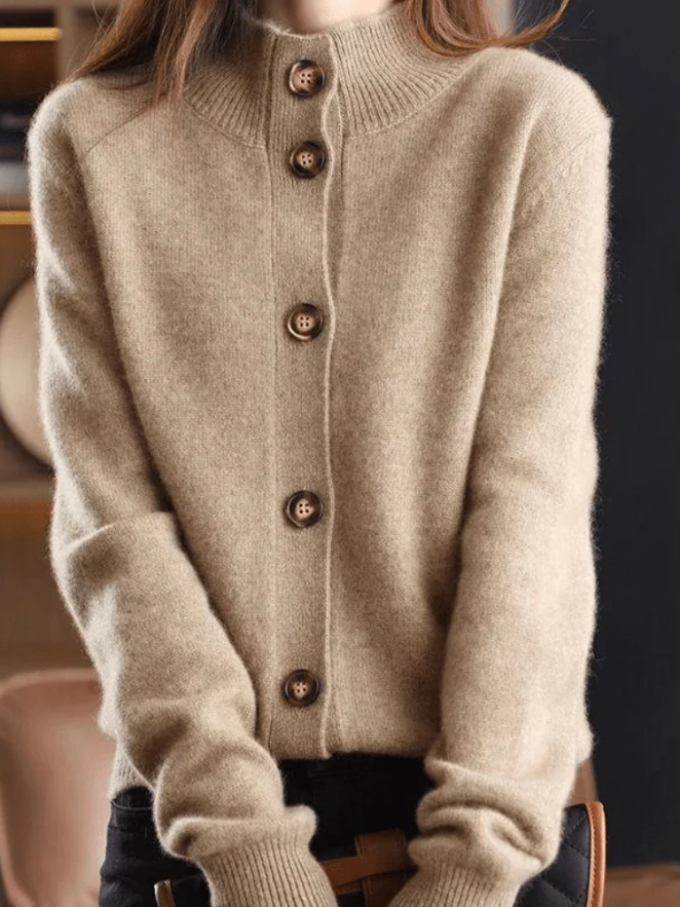 Beige knit button-front cardigan with pointed collar and wood-tone buttons