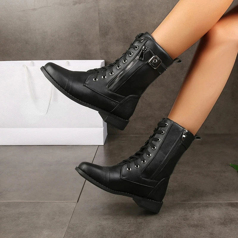 Black leather lace-up boots with side buckle strap and thick sole