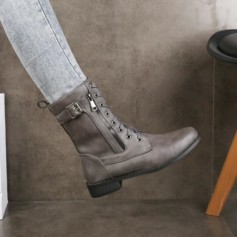 Grey leather lace-up ankle boots with side buckle strap and chunky sole