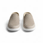 Beige indoor slip-on slippers with textured knit uppers and white rubber sole