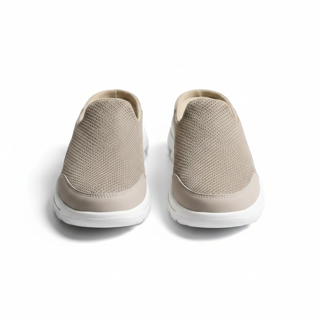 Beige indoor slip-on slippers with textured knit uppers and white rubber sole