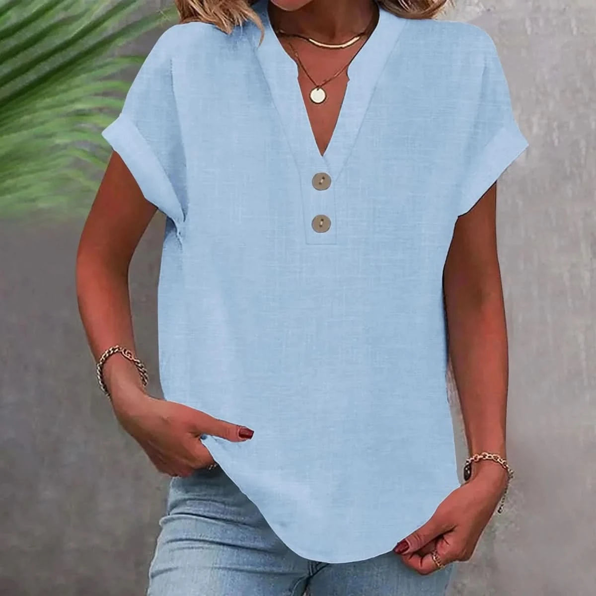 Breathable linen V-neck top in light blue with short sleeves and button-front placket