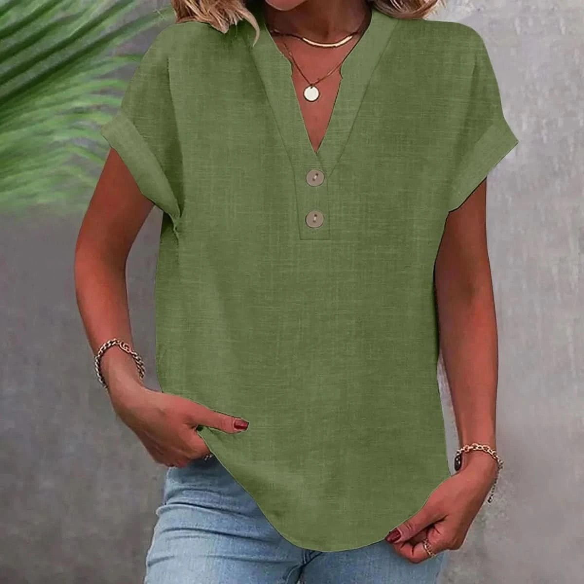 Breathable linen V-neck top in green with short sleeves and button-front placket