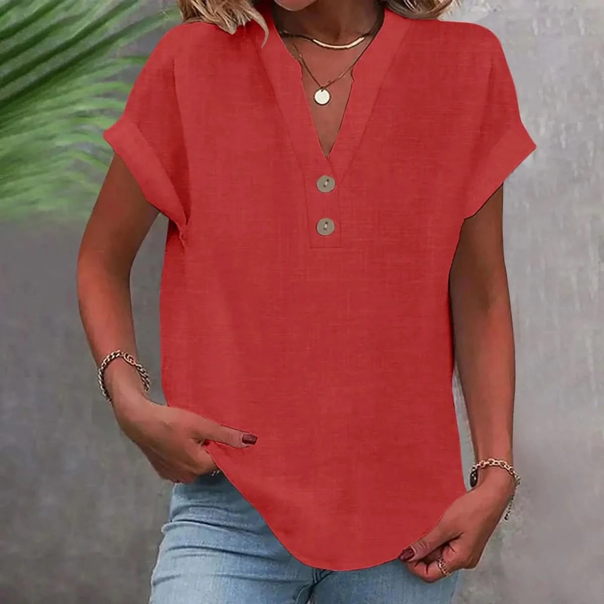 Red linen V-neck top with short sleeves and button-front placket