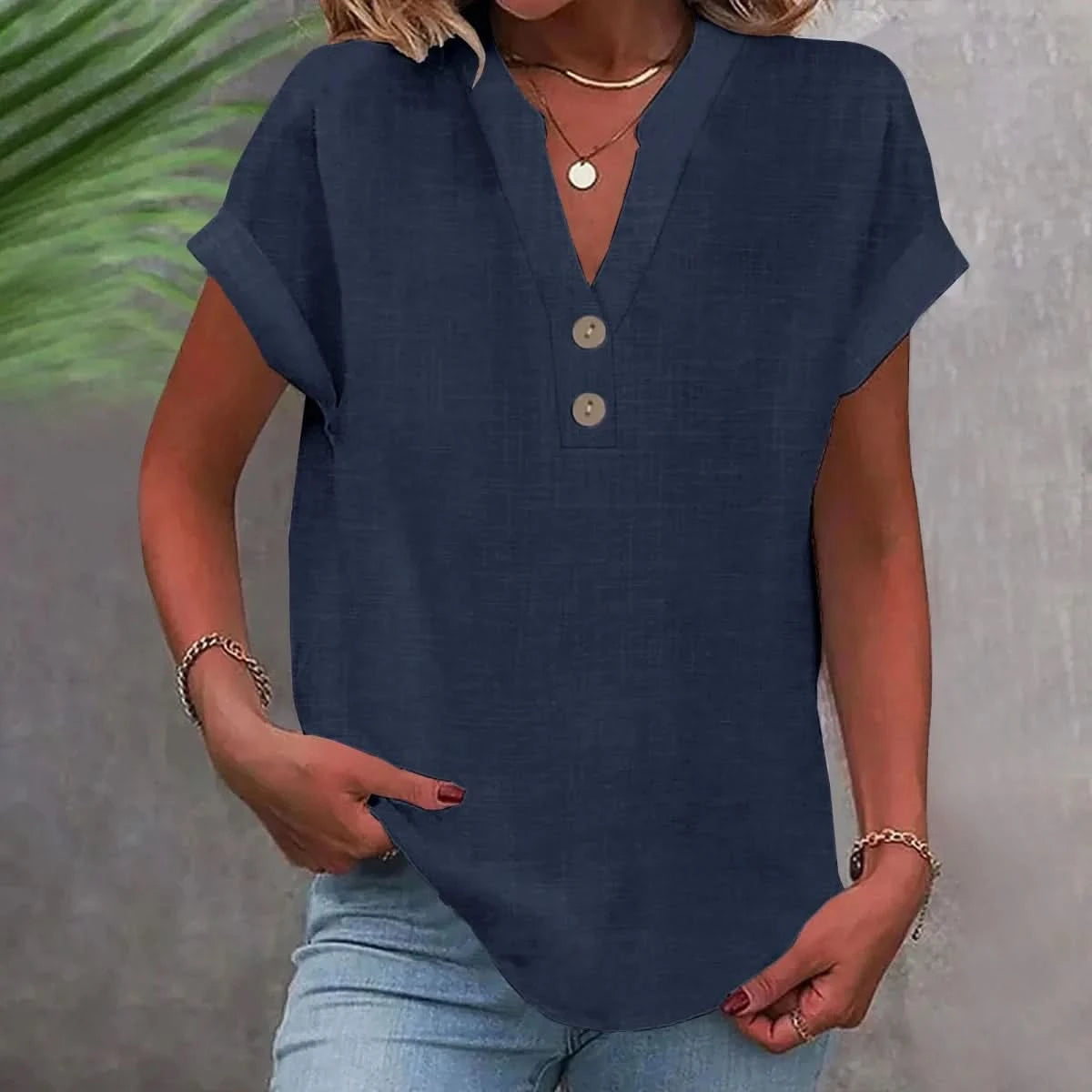 Navy blue linen V-neck top with short sleeves and button-front placket