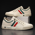 Pair of light sand low-top knit sneakers with red, green, and white side stripe