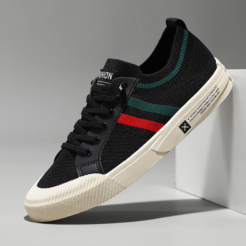 Black knit sneakers with red, green, and white side stripe and lace-up front