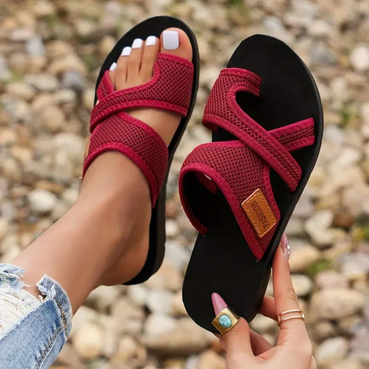 Red women’s comfort sandals with dual straps and cushioned slide sole