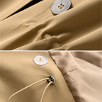Hazelnut brown trench coat fabric close-up with button and stitched placket