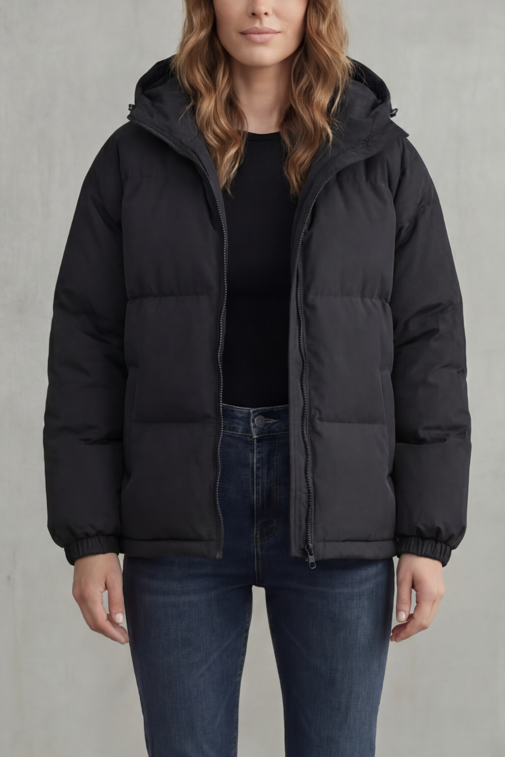 Black quilted hooded puffer jacket with full zip front and elastic sleeve cuffs
