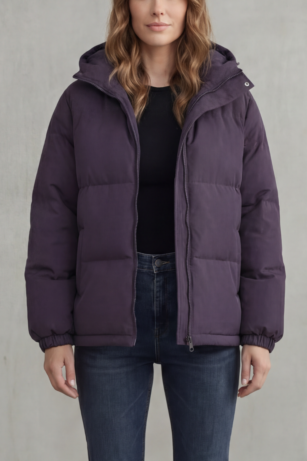 Purple quilted hooded puffer jacket with front zipper and ribbed cuffs