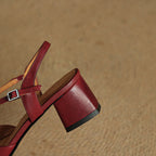 Red heeled slingback sandal with ankle buckle strap and chunky block heel