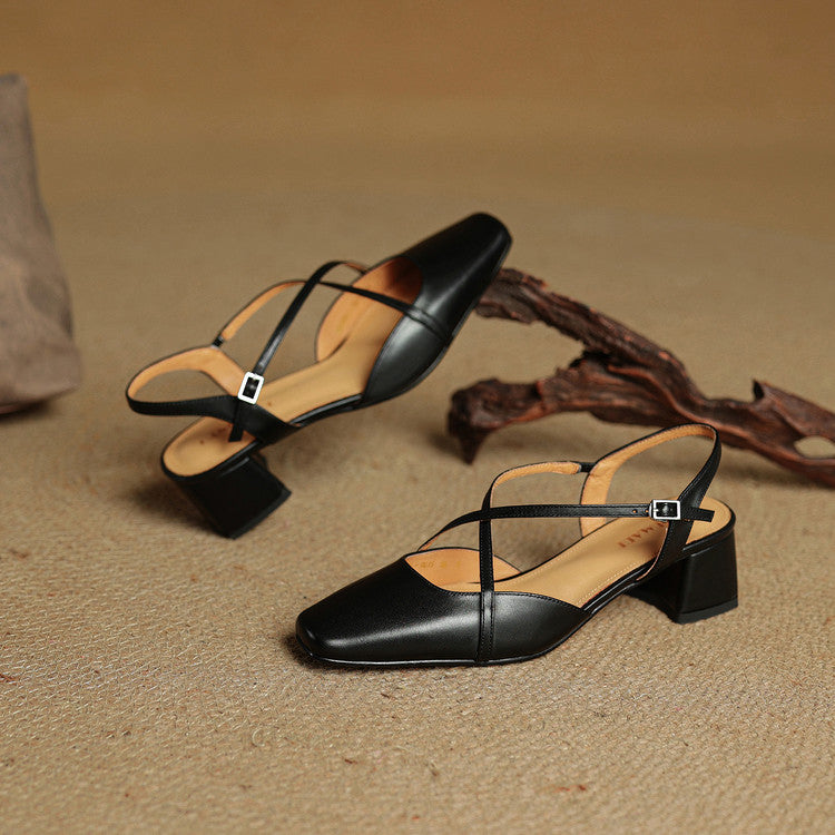 Black pointed-toe heeled slingback flats with cross straps and chunky block heel