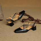 Black pointed-toe heeled slingback flats with cross straps and chunky block heel