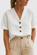 White short-sleeve blouse, V-neck button front with gold-toned buttons