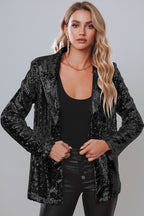 Black sequin blazer with open front, long sleeves, and straight silhouette