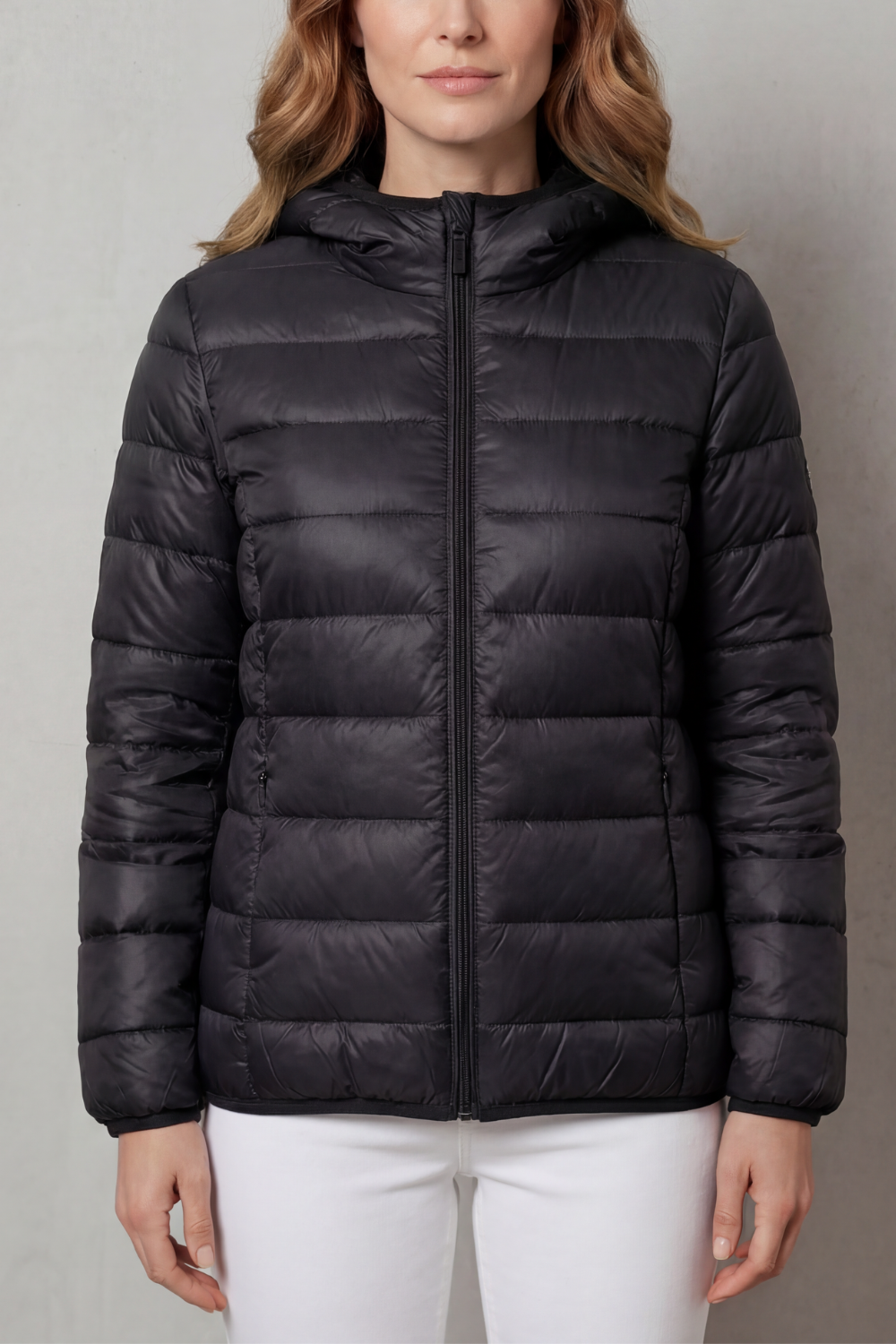 Lightweight hooded puffer jacket in black with full-zip front