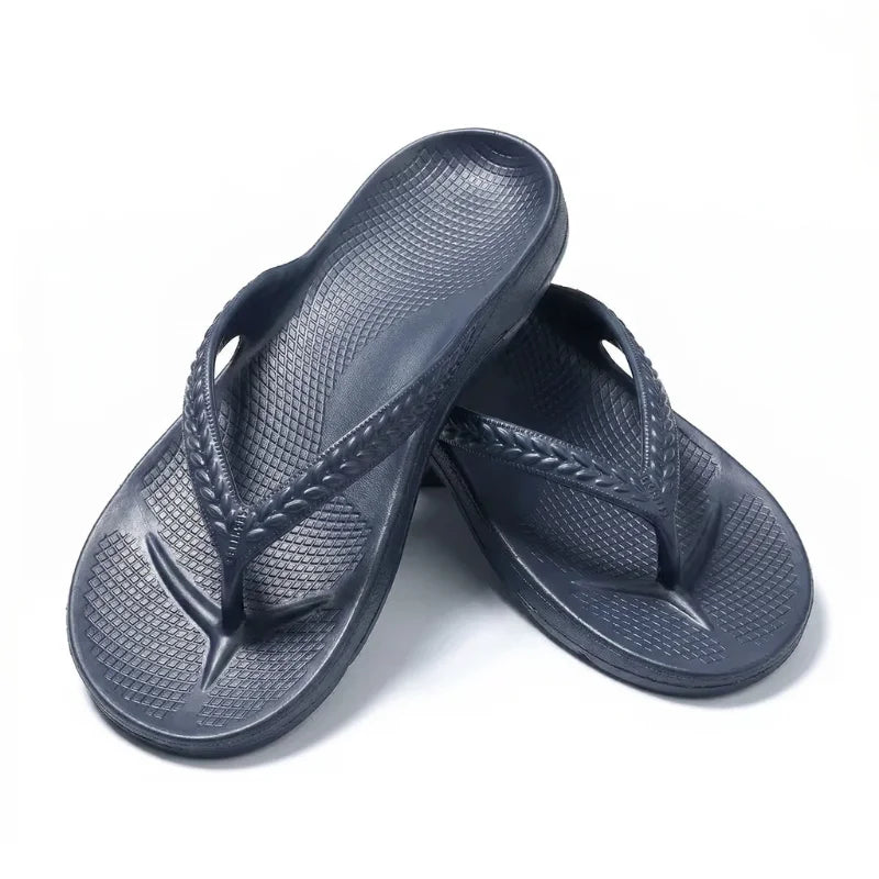 Navy thong flip flops close-up with textured finish and braided strap
