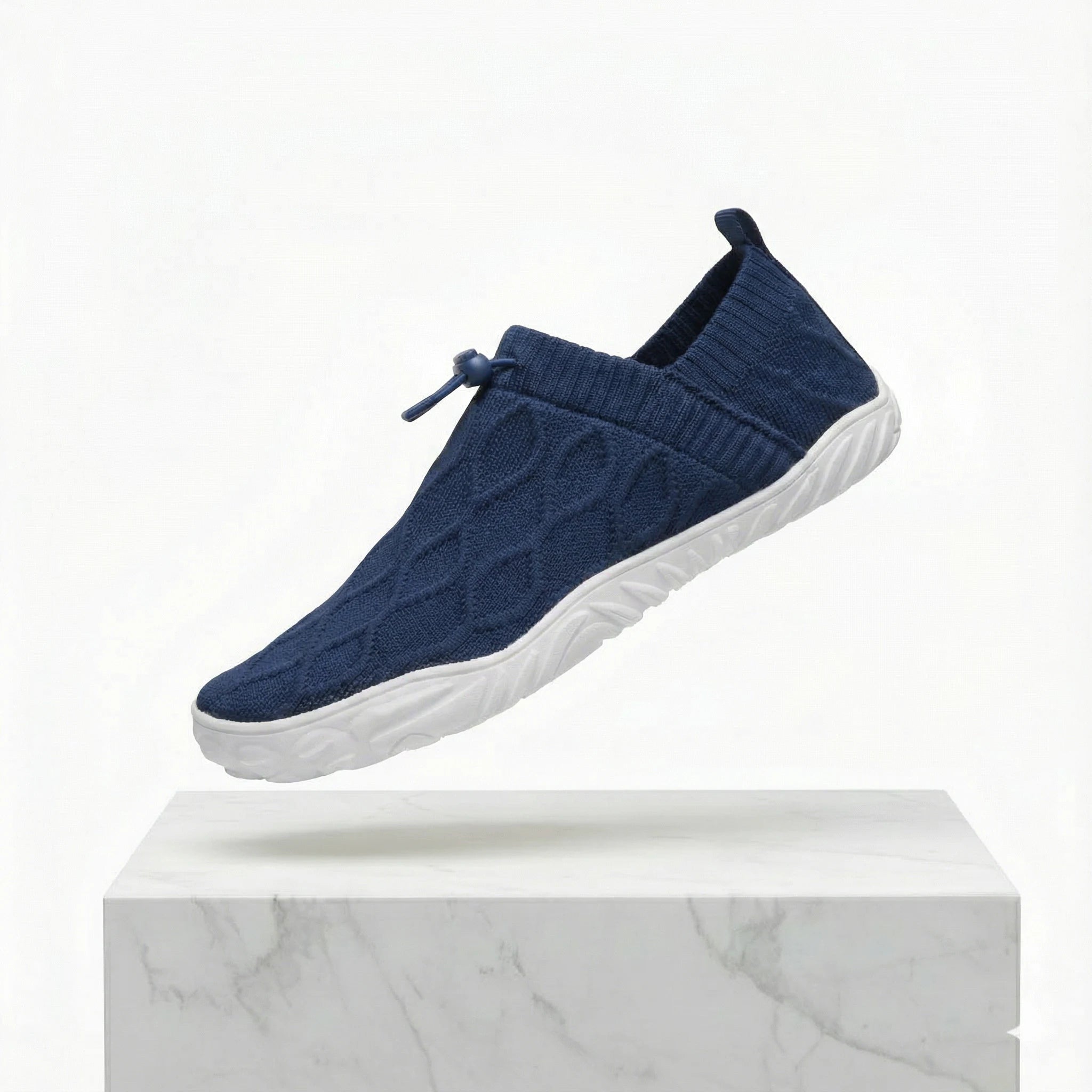 Navy knit slip-on shoes with wide toe box and white cushioned sole