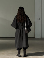 Dark gray long wool belted coat with stand collar, back view