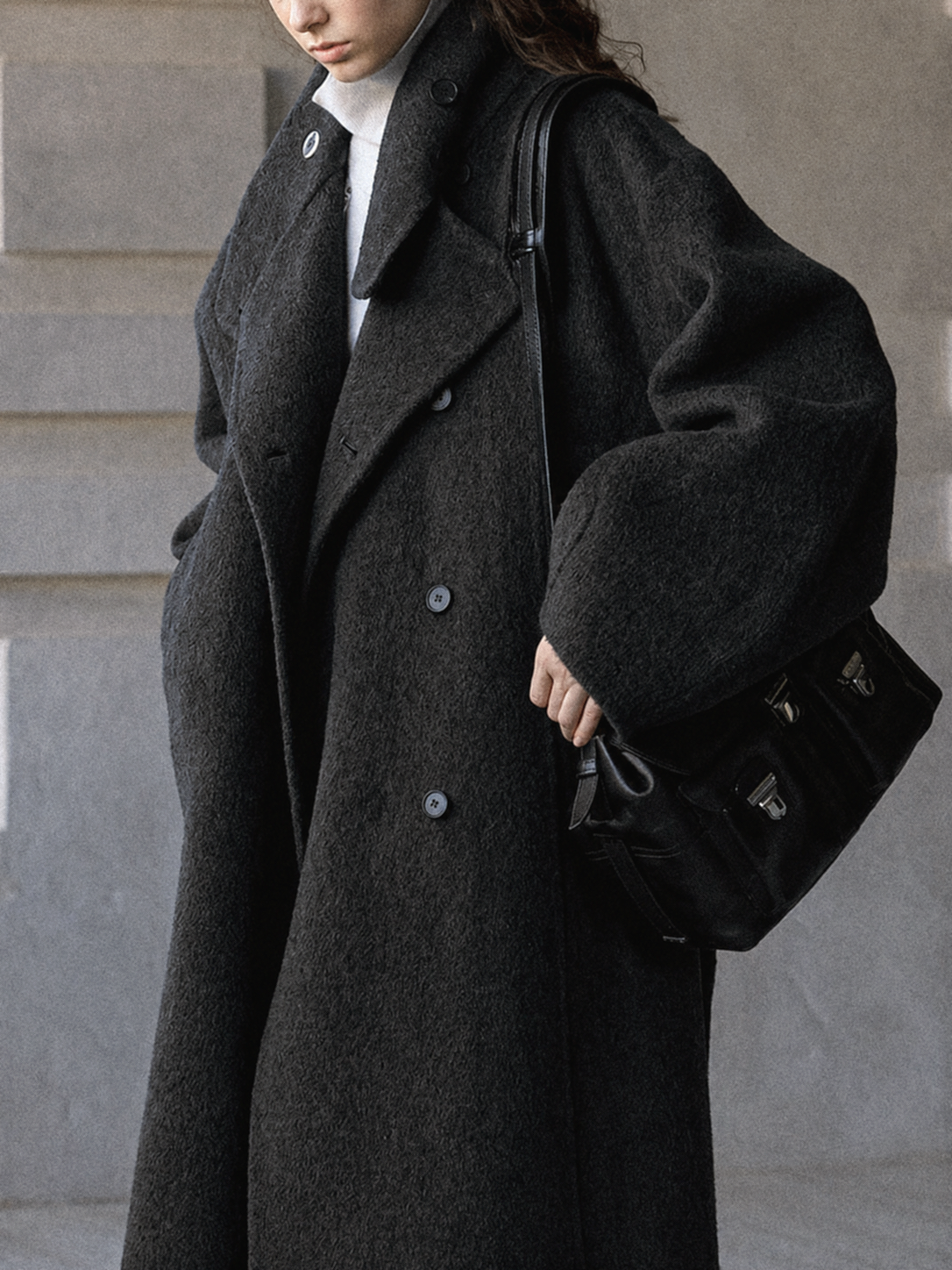 Dark gray wool long coat with stand collar, double-breasted buttons, and belted waist