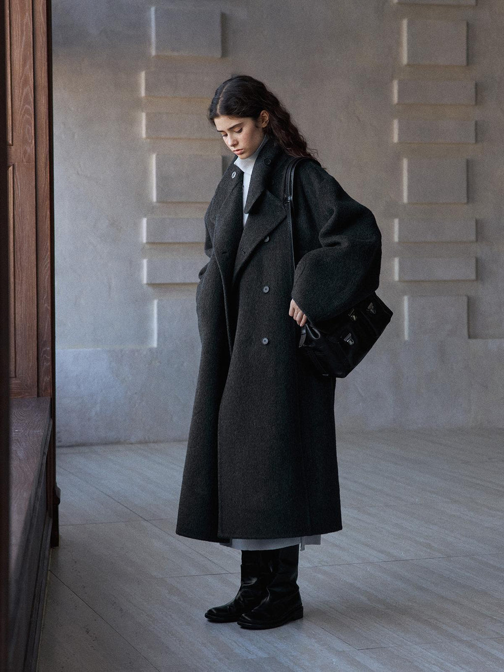 Dark gray wool long coat with stand collar and button placket, side view