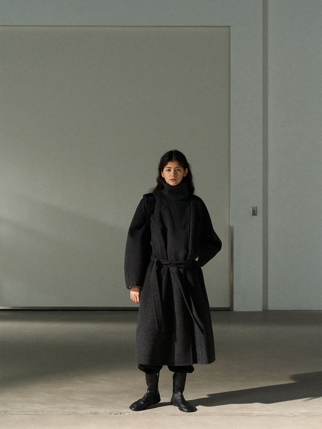Dark gray wool long coat with stand collar and belt, front full-length
