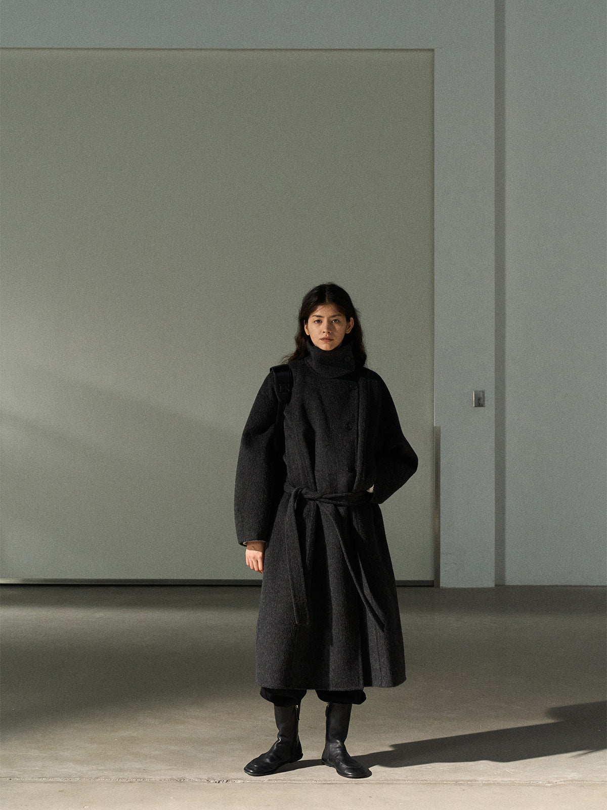 Dark gray wool long coat with stand collar and belt, front full-length