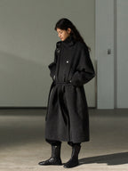 Dark gray wool long coat with stand collar and tie belt, front view