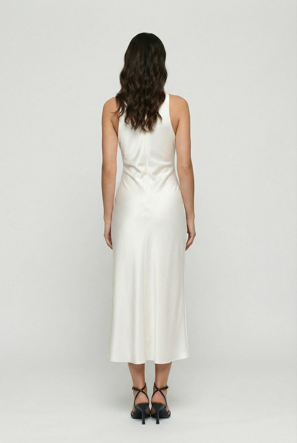 White satin midi dress with draped back neckline and ruched waist, sleeveless