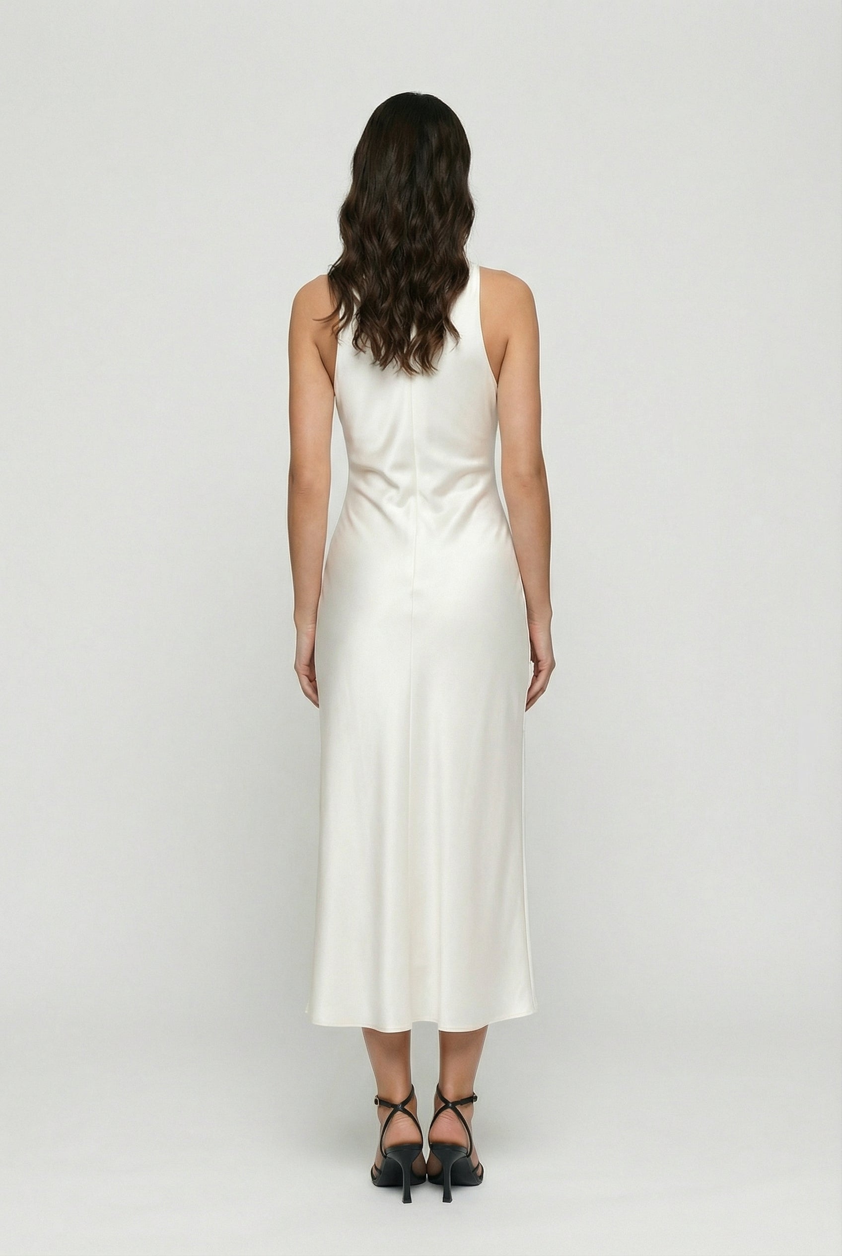 White satin midi dress with draped back neckline and ruched waist, sleeveless